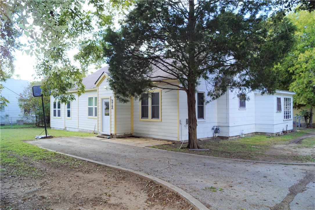 312 Taylor Road Elgin, TX 78621 - Photo 1 of 1 a front view of a house with a yard and garage