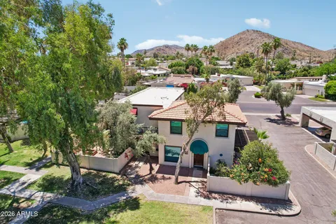 an aerial view of residential houses with outdoor space