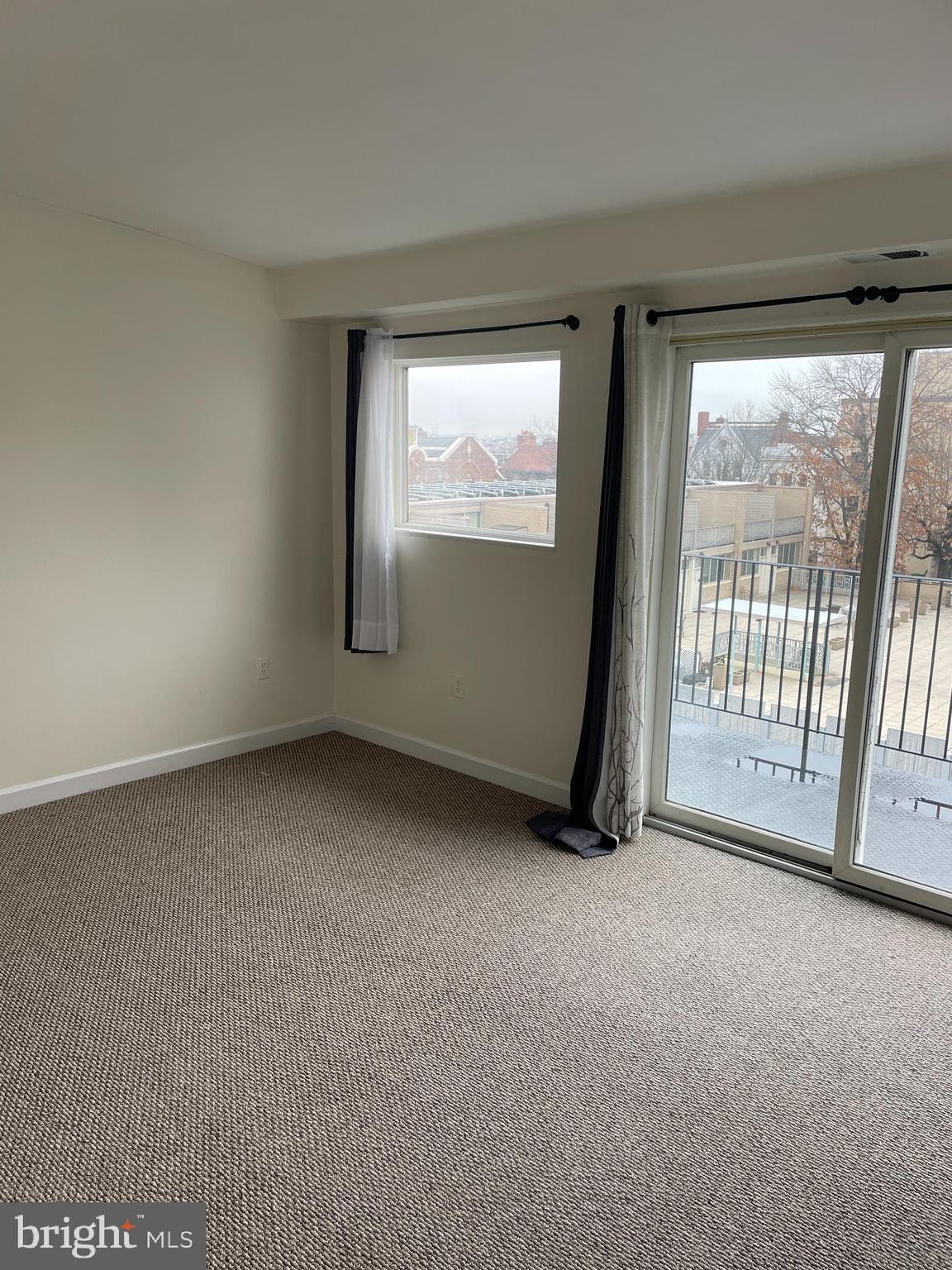 1856 Kalorama Road Northwest, Unit 4 Washington, DC 20009 - Photo 5 of 6 a view of an empty room with a window