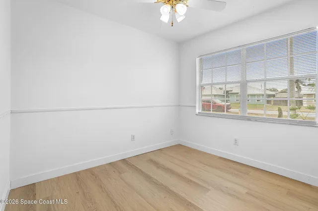 an empty room with a empty space and a window