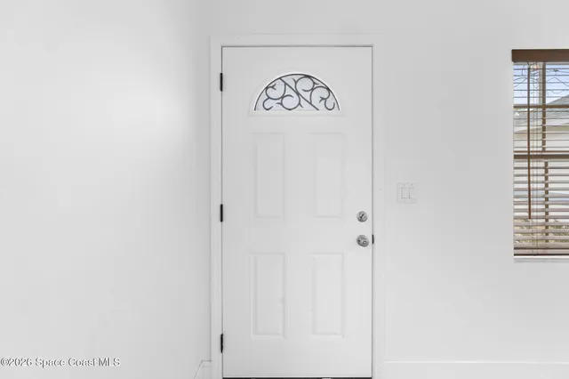 a view of a hallway with a window