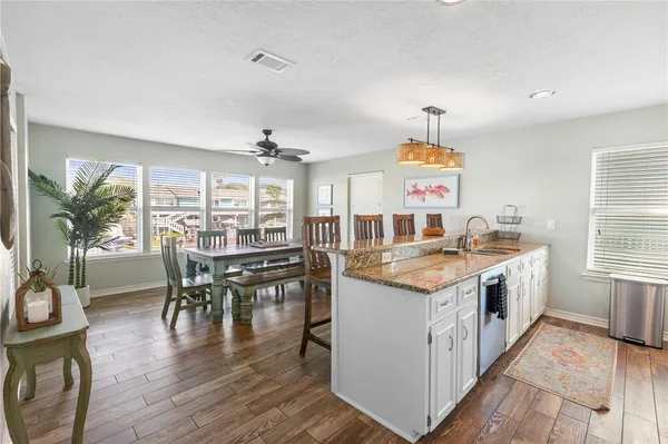 a dining room with furniture and window
