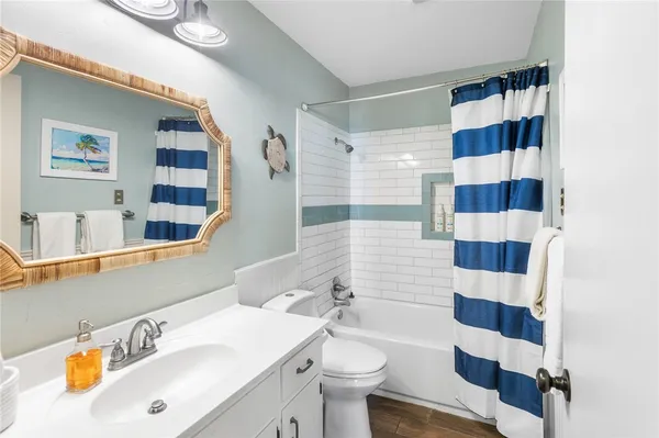 a balcony with couch and wooden floor