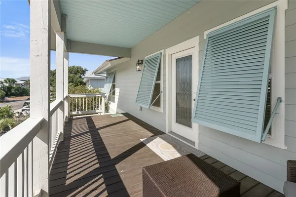 a view of a balcony with chairs