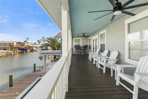 a view of a balcony with chairs