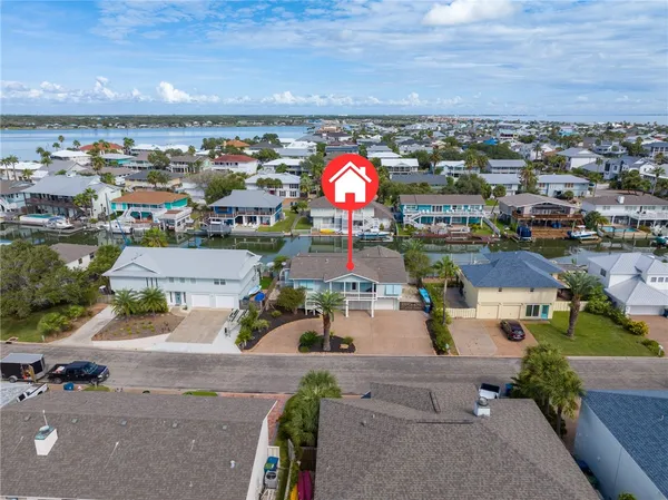 an aerial view of residential houses with outdoor space
