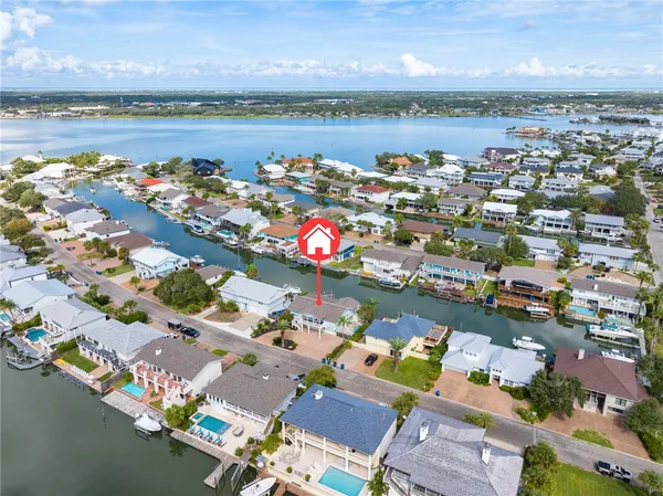 an aerial view of a house with swimming pool