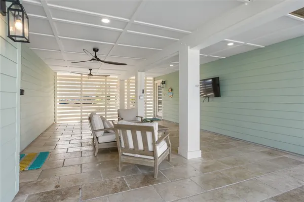 a view of a hallway with seating area