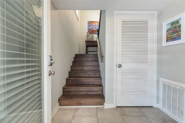 a view of a hallway with paintings on the wall