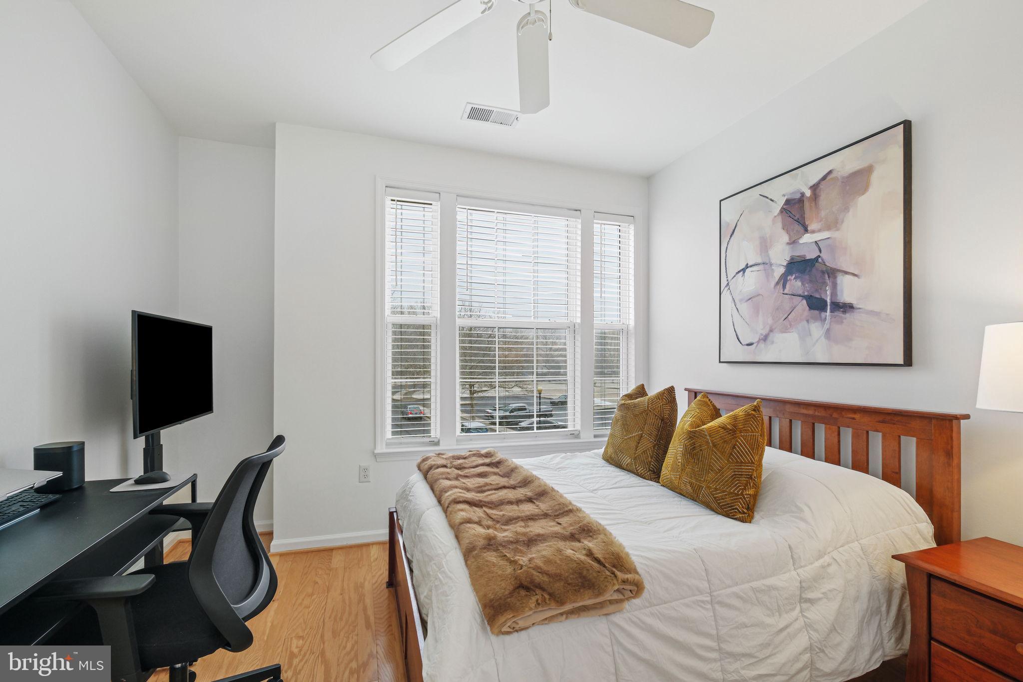 8 Granite Place, Unit 266 Gaithersburg, MD 20878 - Photo 22 of 49 a bedroom with a bed and a flat screen tv