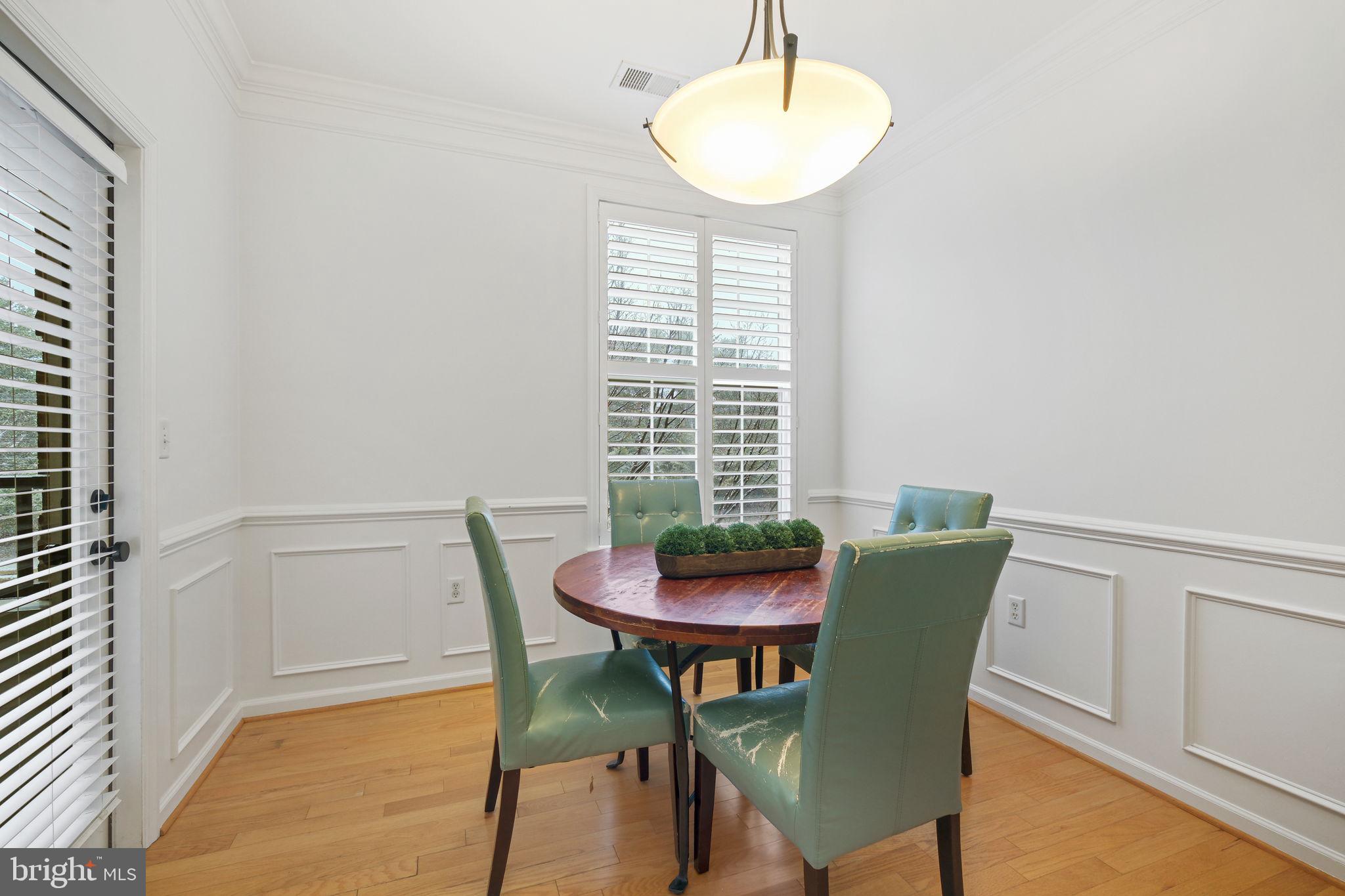 8 Granite Place, Unit 266 Gaithersburg, MD 20878 - Photo 10 of 49 a view of a dining room with furniture and a window
