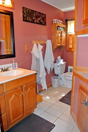 251 High St Extension Lancaster, MA 01523 - Photo 11 of 18 a bathroom with a sink a mirror and a shower