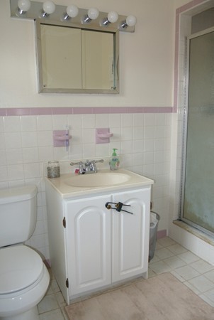 251 High St Extension Lancaster, MA 01523 - Photo 12 of 18 a bathroom with a sink a toilet and mirror