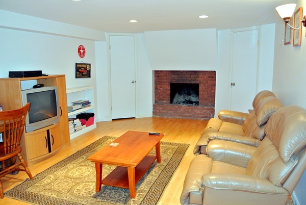 251 High St Extension Lancaster, MA 01523 - Photo 15 of 18 a living room with furniture and a fireplace