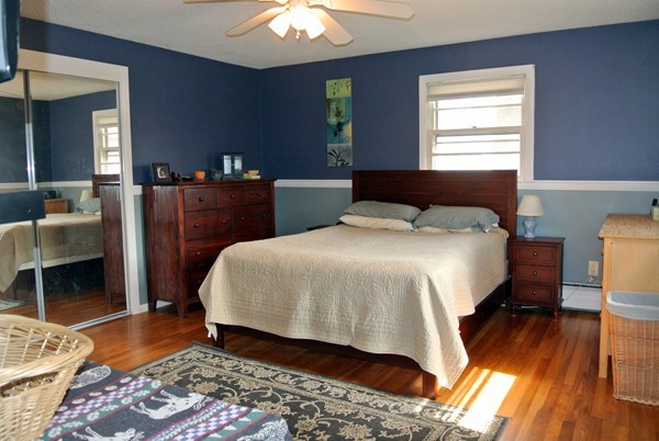 251 High St Extension Lancaster, MA 01523 - Photo 7 of 18 a bedroom with a bed and wooden floor