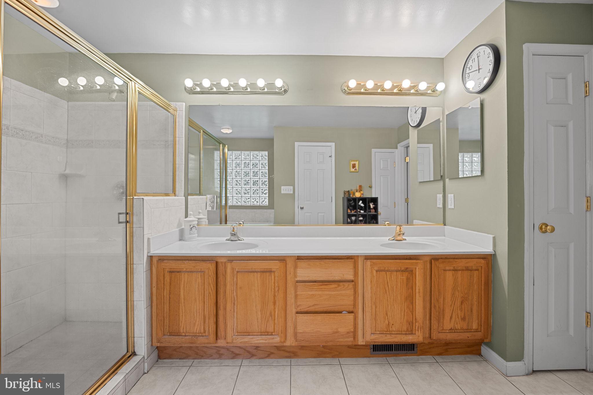 23439 Watson Road Leesburg, VA 20175 - Photo 20 of 41 a bathroom with a sink vanity and a mirror