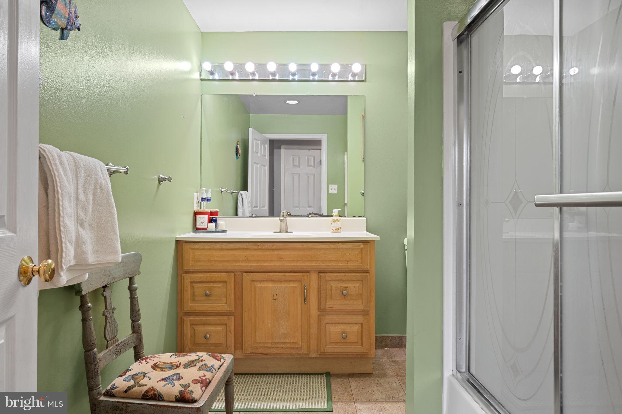23439 Watson Road Leesburg, VA 20175 - Photo 22 of 41 a bathroom with a sink mirror and vanity