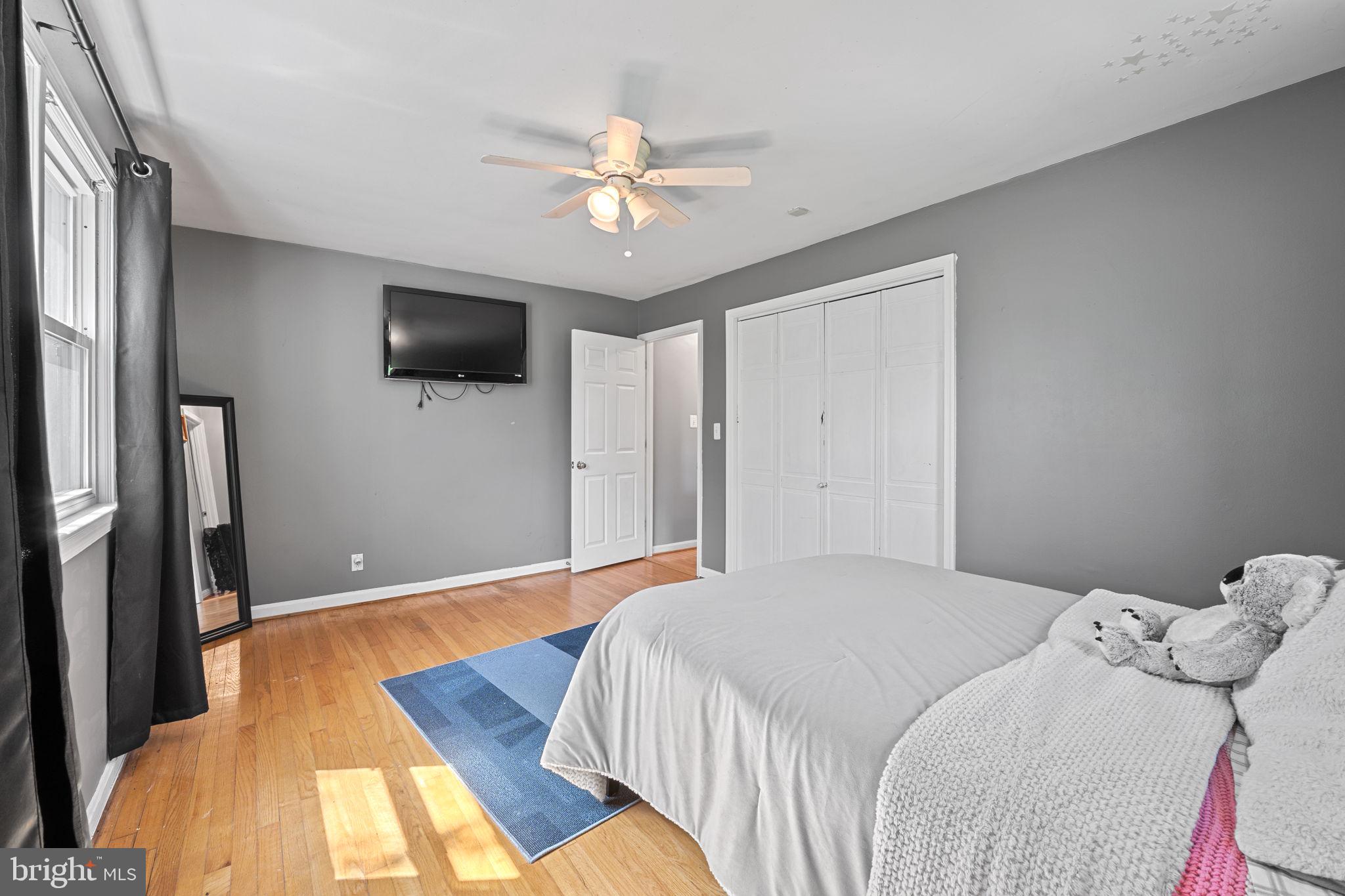 23439 Watson Road Leesburg, VA 20175 - Photo 23 of 41 a bedroom with a large bed and a flat screen tv
