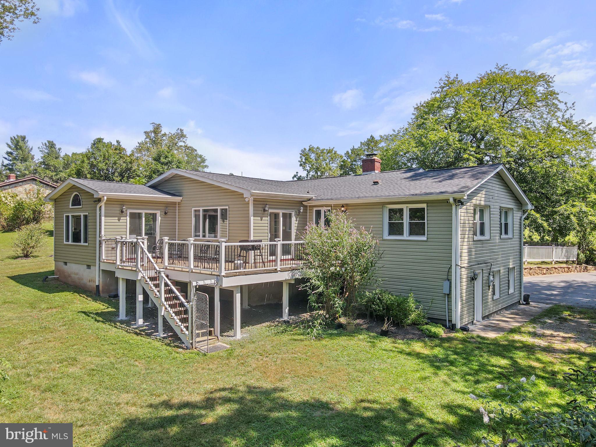 23439 Watson Road Leesburg, VA 20175 - Photo 29 of 41 a front view of a house with a yard table and chairs