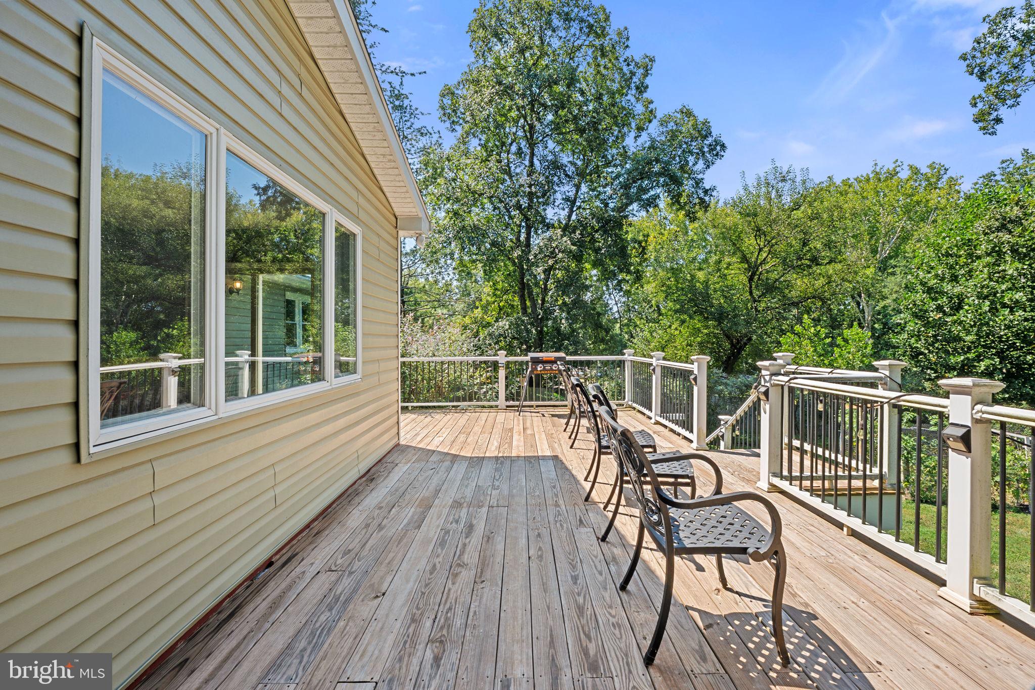 23439 Watson Road Leesburg, VA 20175 - Photo 30 of 41 a view of a chair and table on the wooden deck