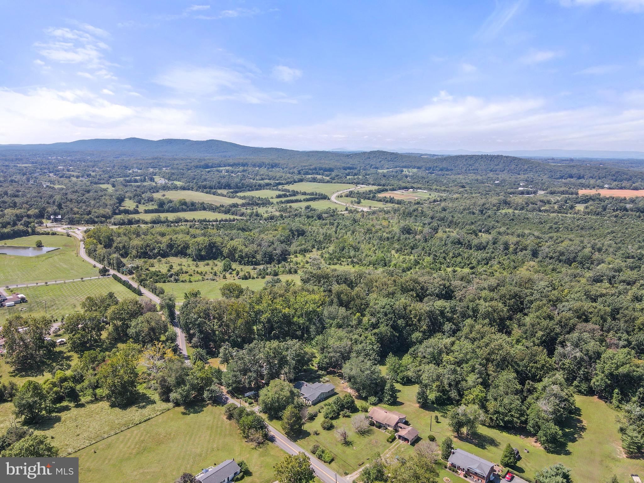 23439 Watson Road Leesburg, VA 20175 - Photo 35 of 41 a view of a city with mountains in the background