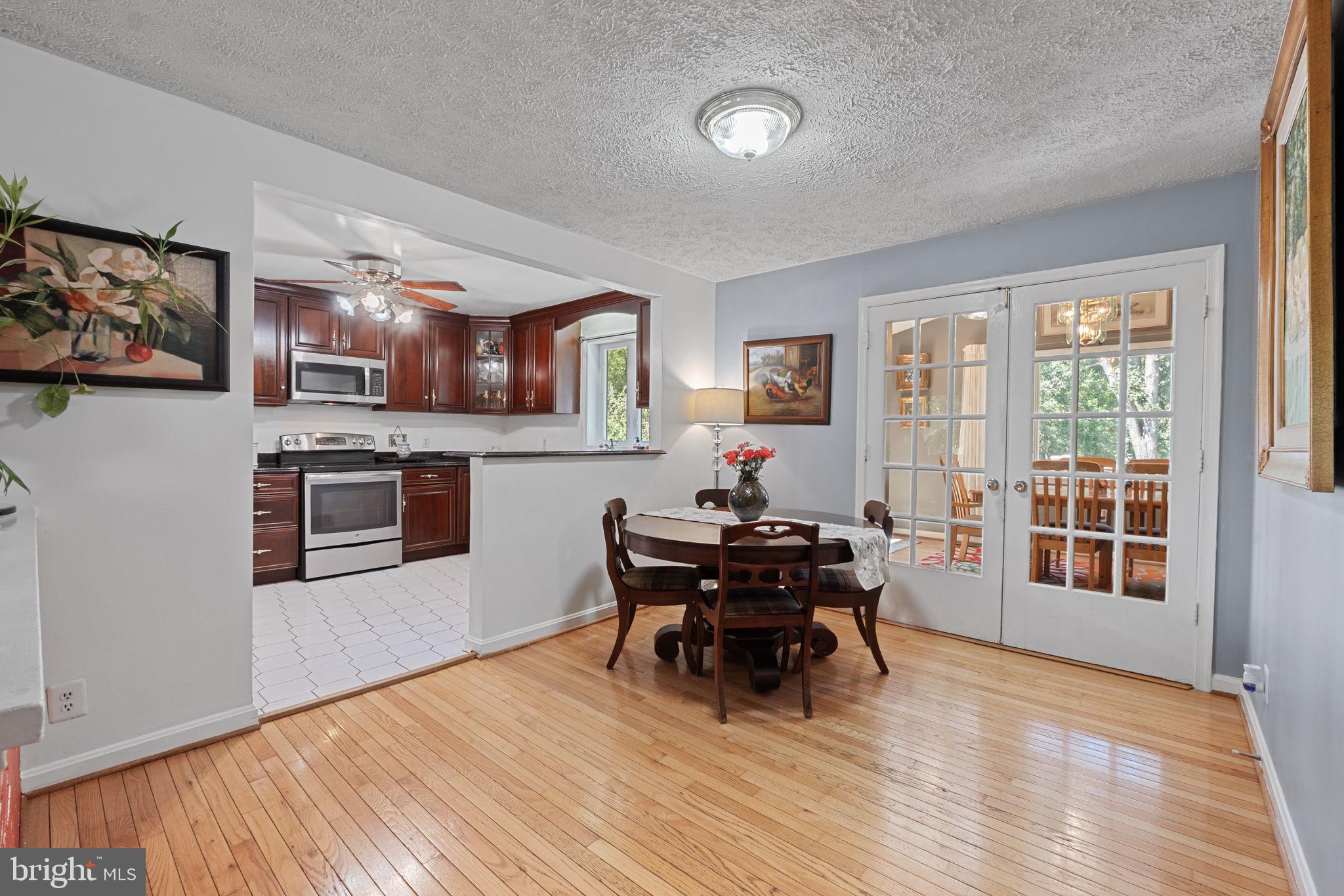 23439 Watson Road Leesburg, VA 20175 - Photo 8 of 41 a view of a dining room with furniture window and wooden floor