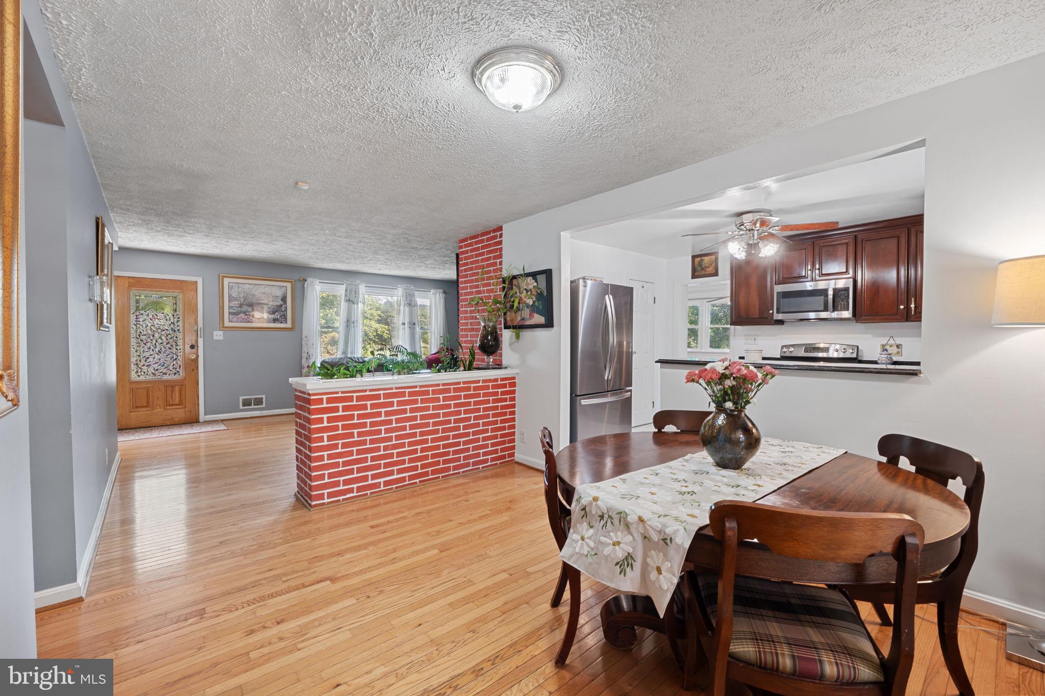 23439 Watson Road Leesburg, VA 20175 - Photo 9 of 41 a dining room with furniture and window