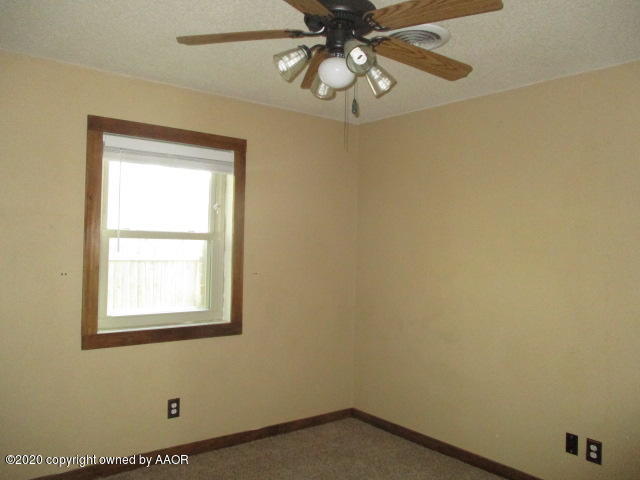 8108 Coronado Trail Amarillo, TX 79110 - Photo 12 of 14 an empty room with a window