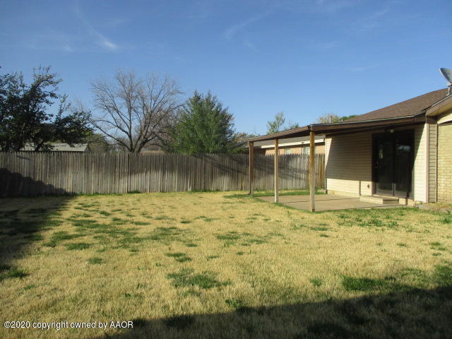 8108 Coronado Trail Amarillo, TX 79110 - Photo 3 of 14 a front view of a house with a garden