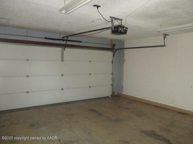 8108 Coronado Trail Amarillo, TX 79110 - Photo 4 of 14 a view of a room with racks on the wall