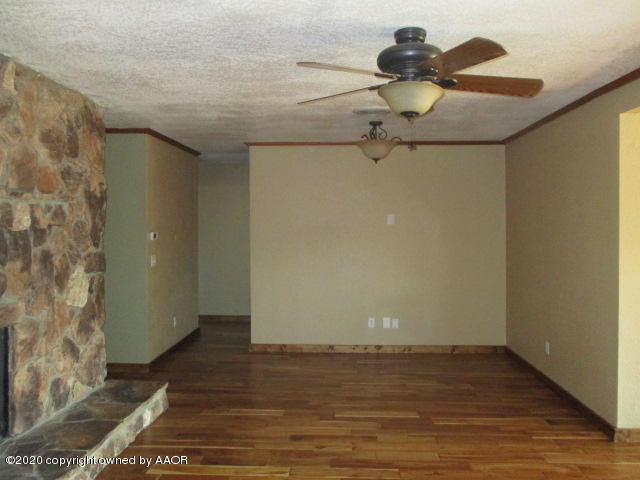 8108 Coronado Trail Amarillo, TX 79110 - Photo 8 of 14 a view of a room with wooden floor