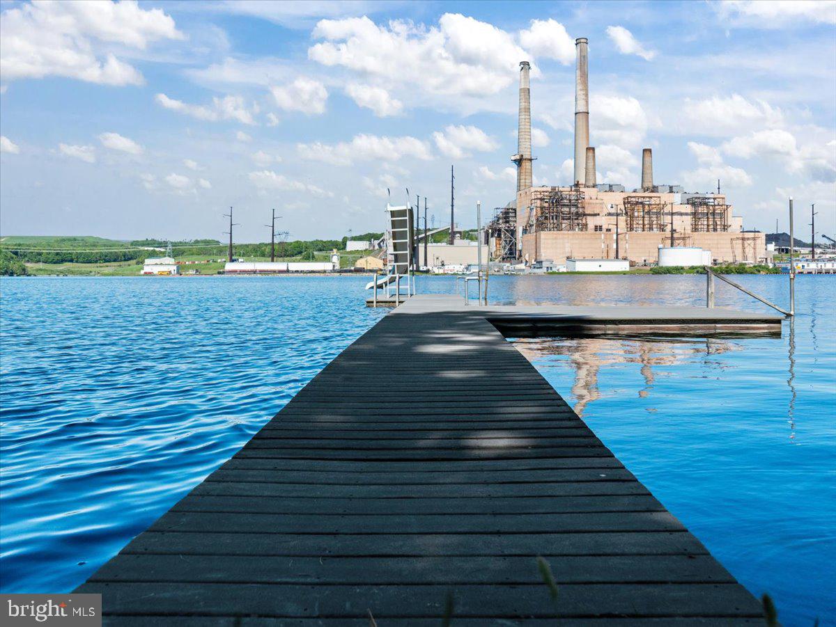 663 Bear Woods Road Mount Storm, WV 26739 - Photo 37 of 73 Serene dock by industrial waterscape.