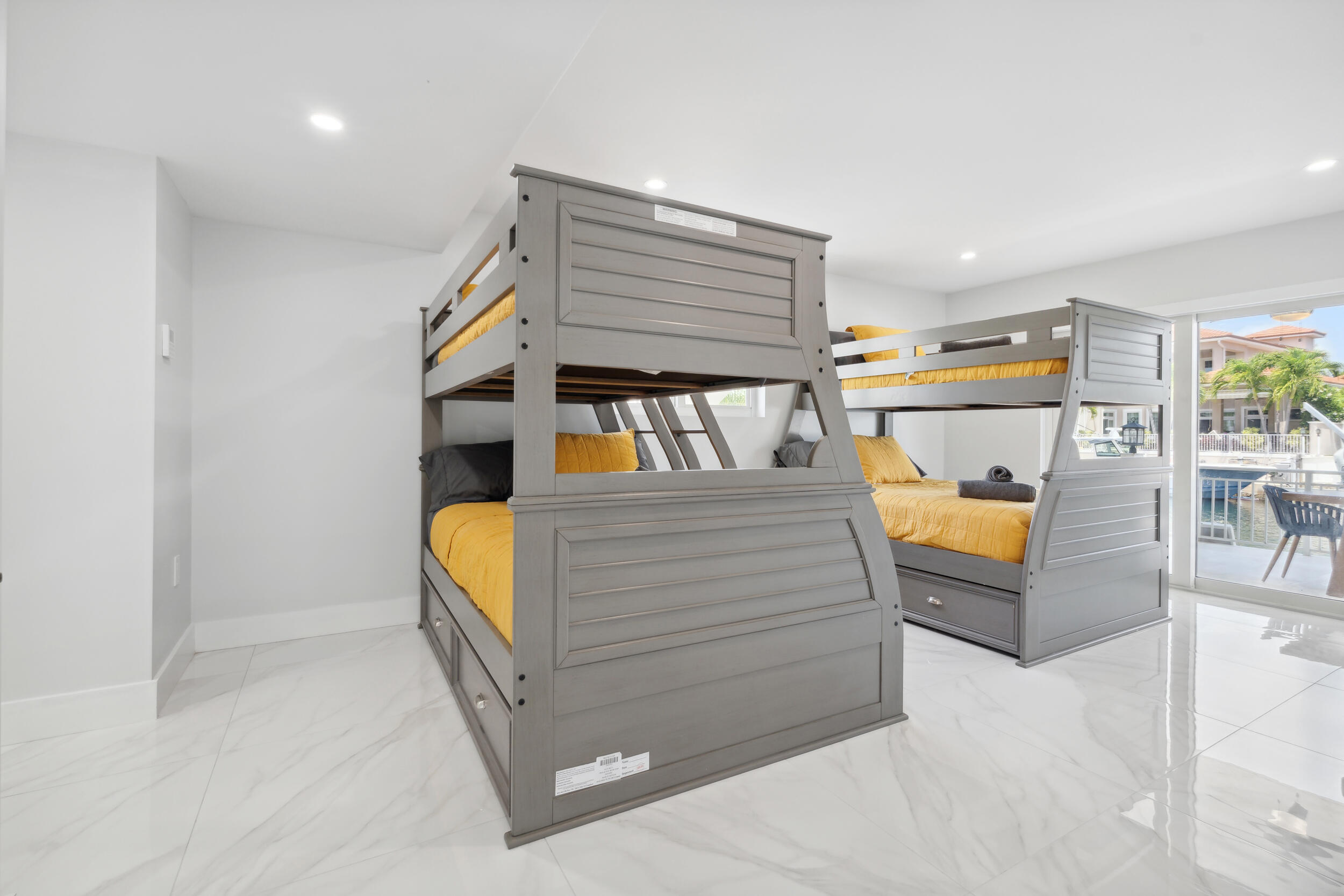 238 Atlantic Boulevard Key Largo, FL 33037 - Photo 14 of 104 a bedroom with furniture and a flat screen tv