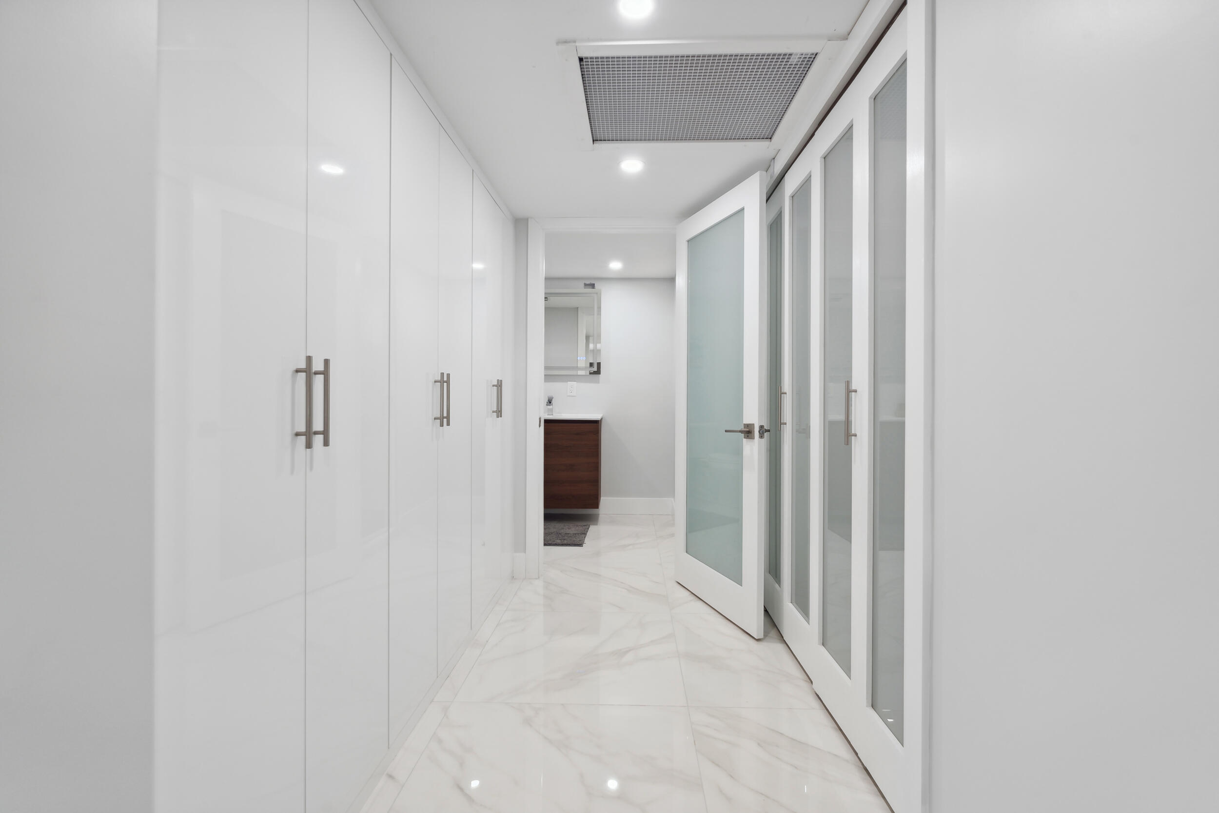 238 Atlantic Boulevard Key Largo, FL 33037 - Photo 15 of 104 a view of a hallway with wooden shelves