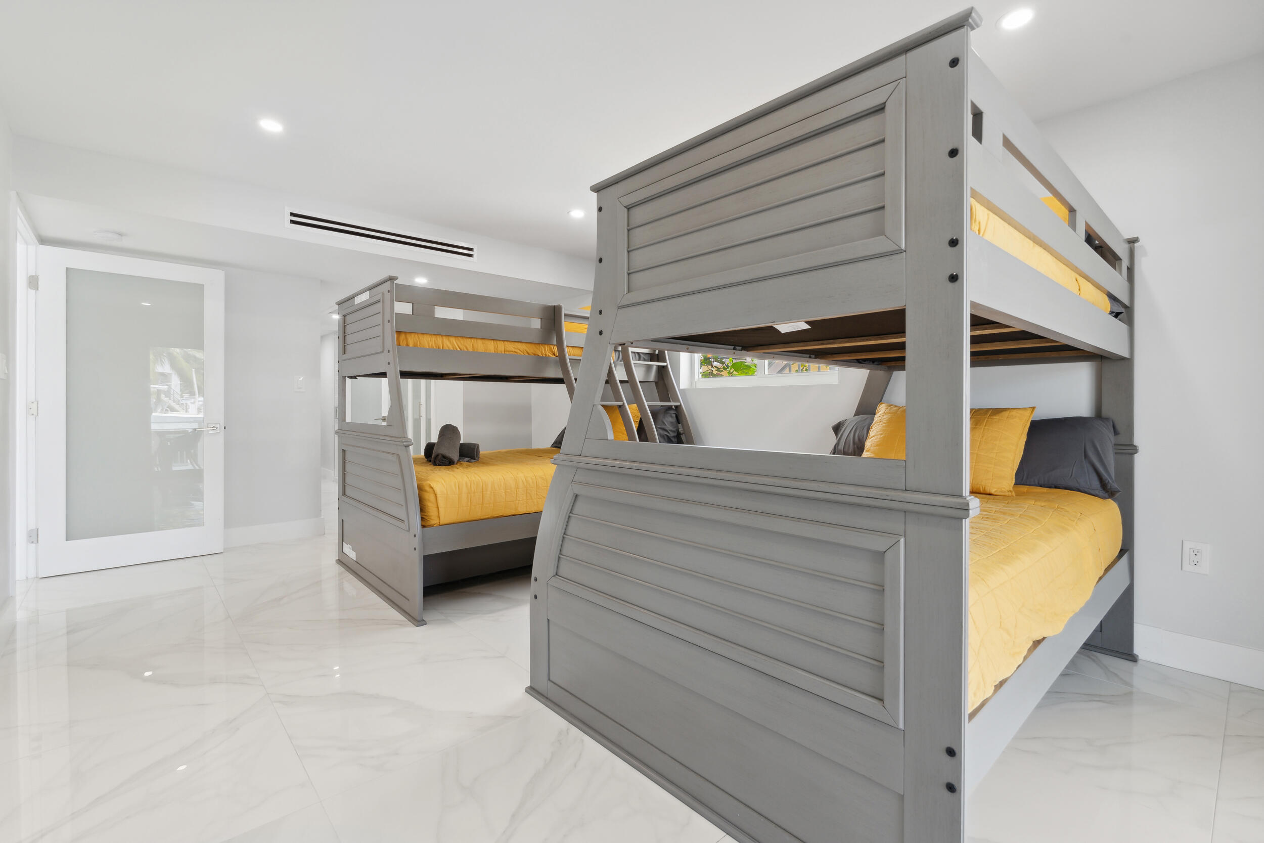 238 Atlantic Boulevard Key Largo, FL 33037 - Photo 17 of 104 a bedroom with a bed and a large window