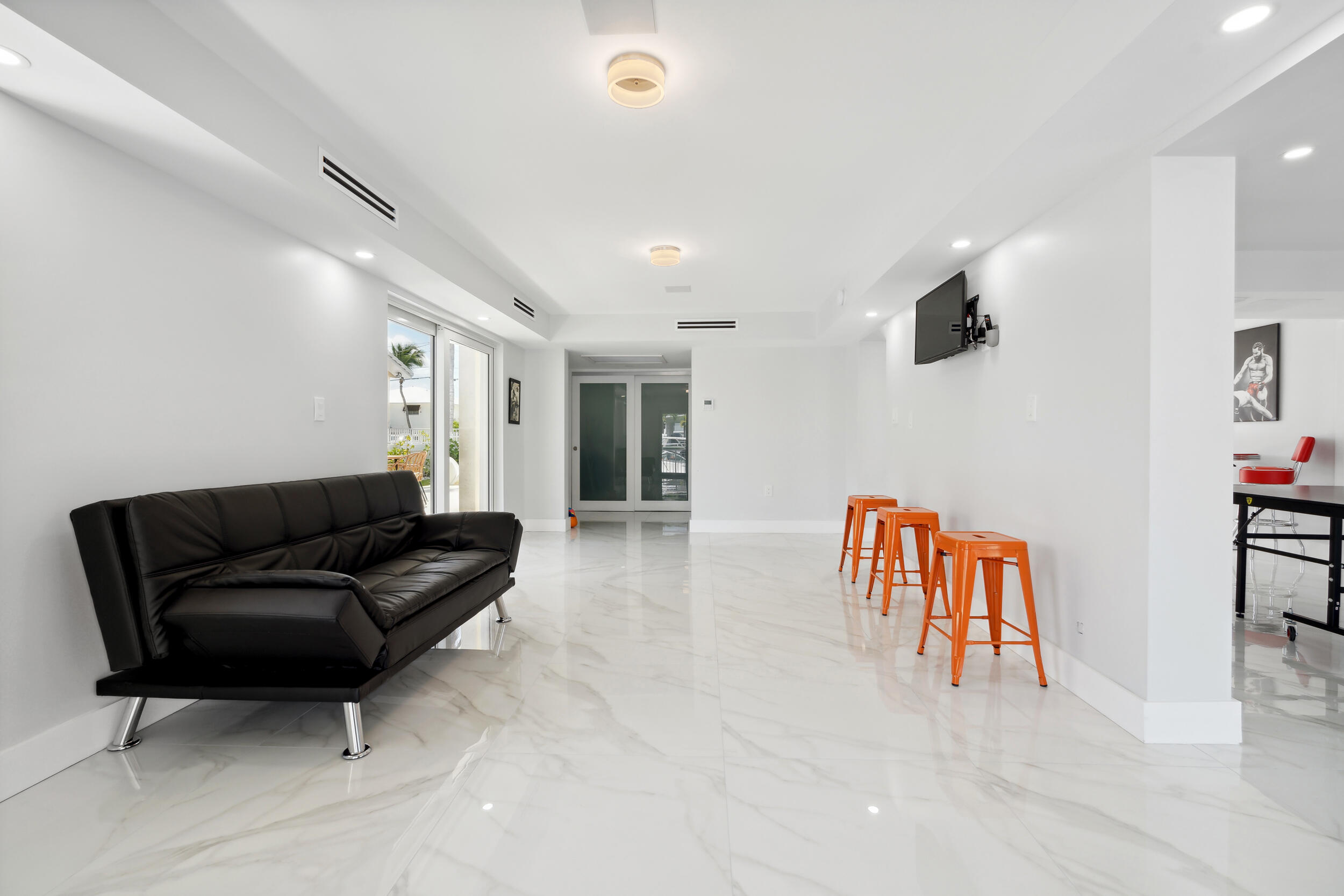 238 Atlantic Boulevard Key Largo, FL 33037 - Photo 20 of 104 a living room with furniture and a flat screen tv