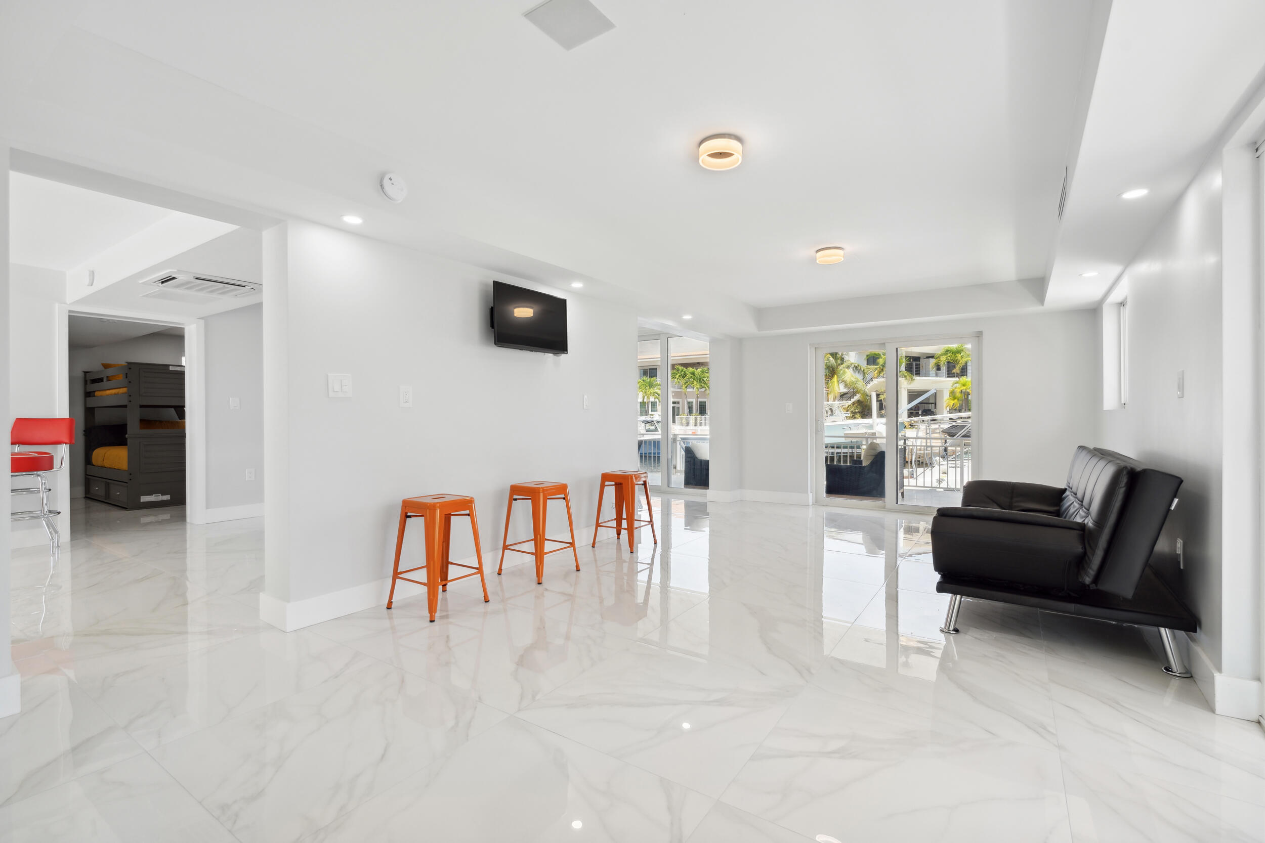238 Atlantic Boulevard Key Largo, FL 33037 - Photo 23 of 104 a living room with furniture and a flat screen tv