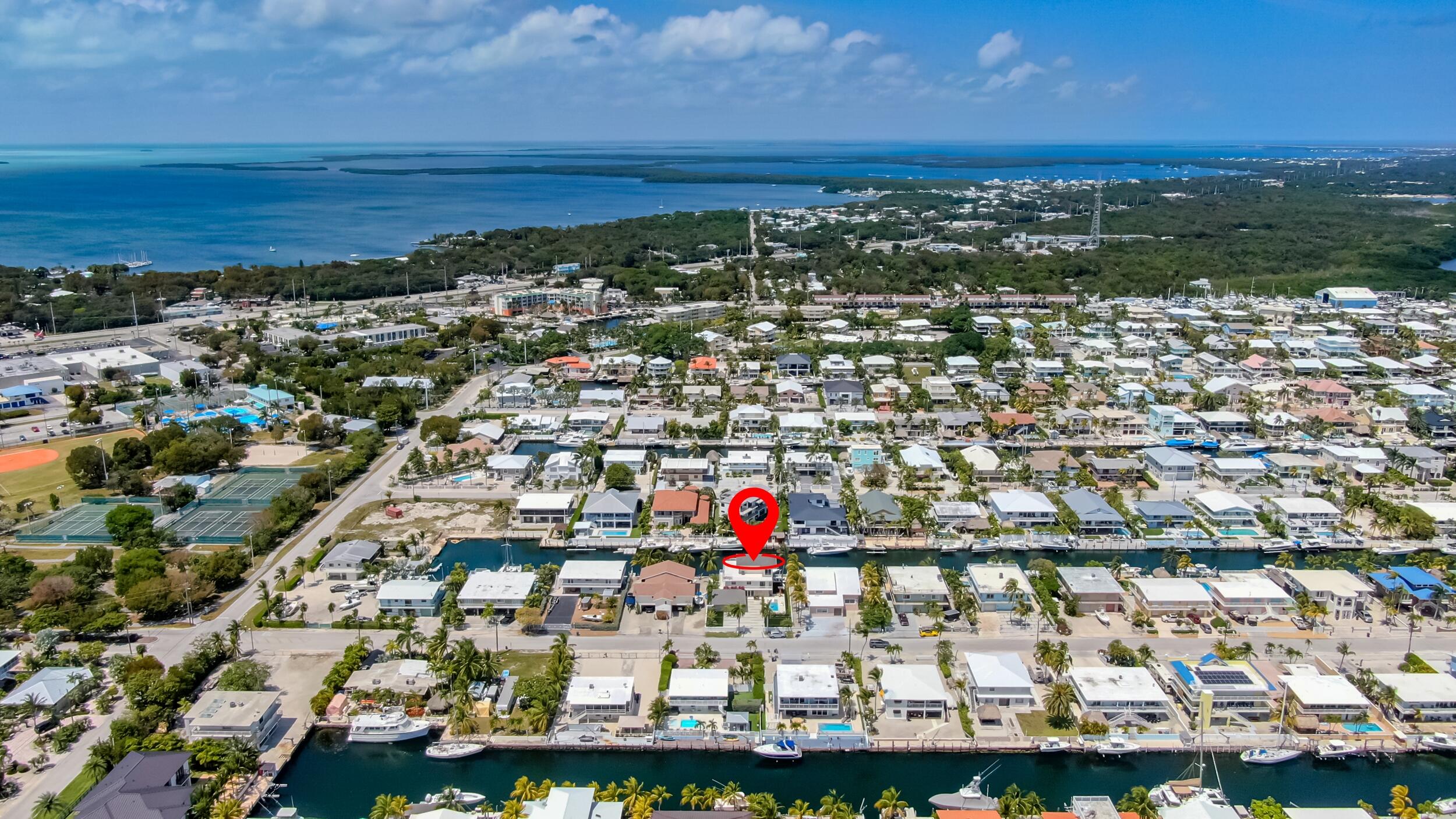 238 Atlantic Boulevard Key Largo, FL 33037 - Photo 5 of 104 an aerial view of residential building and ocean