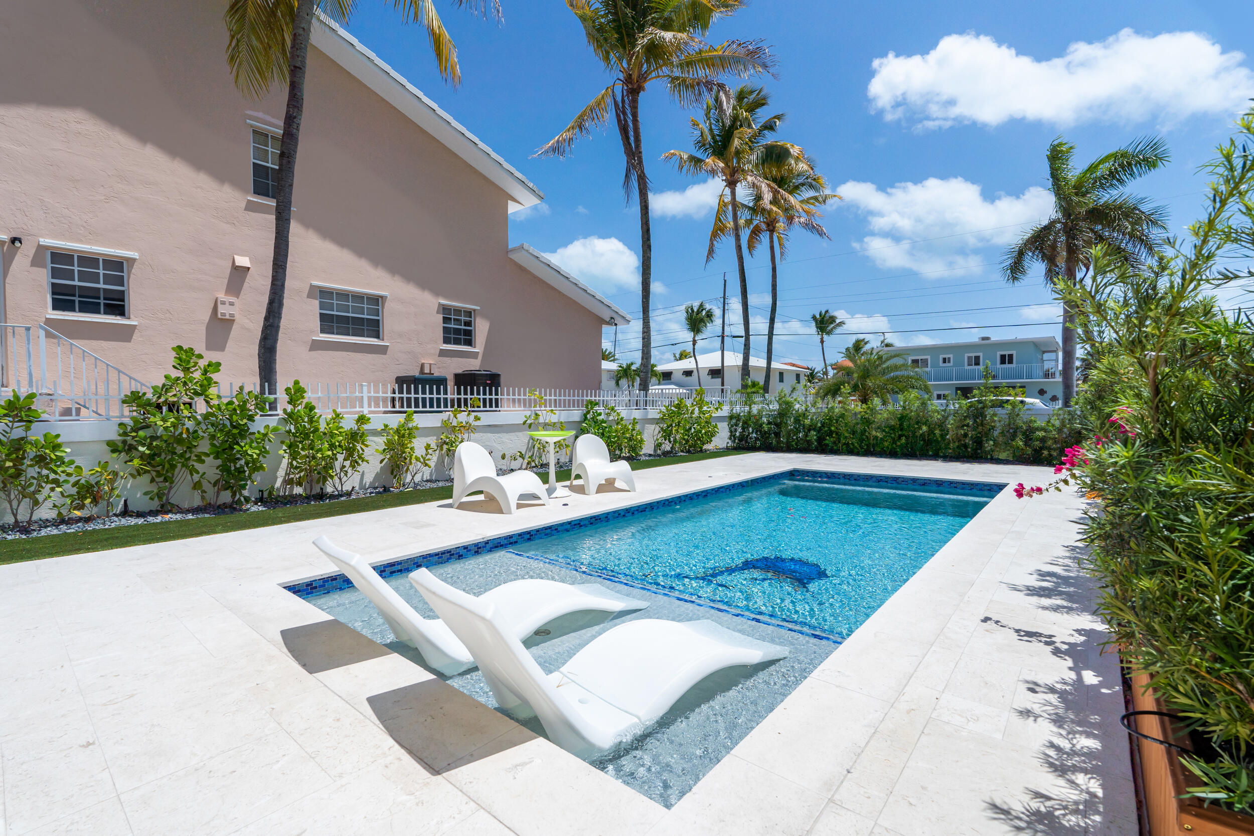238 Atlantic Boulevard Key Largo, FL 33037 - Photo 91 of 104 a view of a swimming pool with a garden