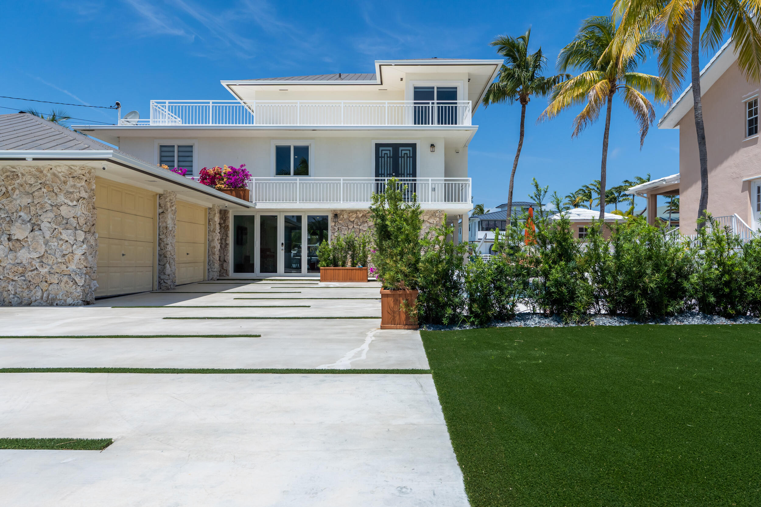 238 Atlantic Boulevard Key Largo, FL 33037 - Photo 98 of 104 a view of a house with a yard