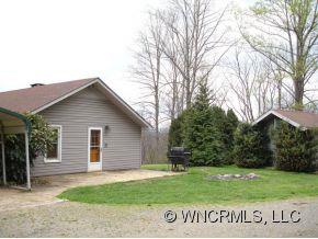 282 Mica Ridge Sylva, NC 28779 - Photo 4 of 11 a view of a house with a yard