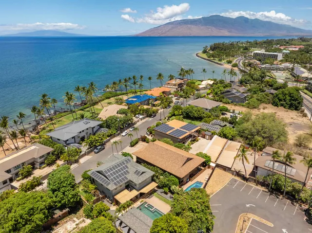 an aerial view of a house with a ocean view