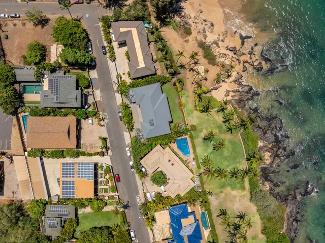 an aerial view of residential houses with outdoor space