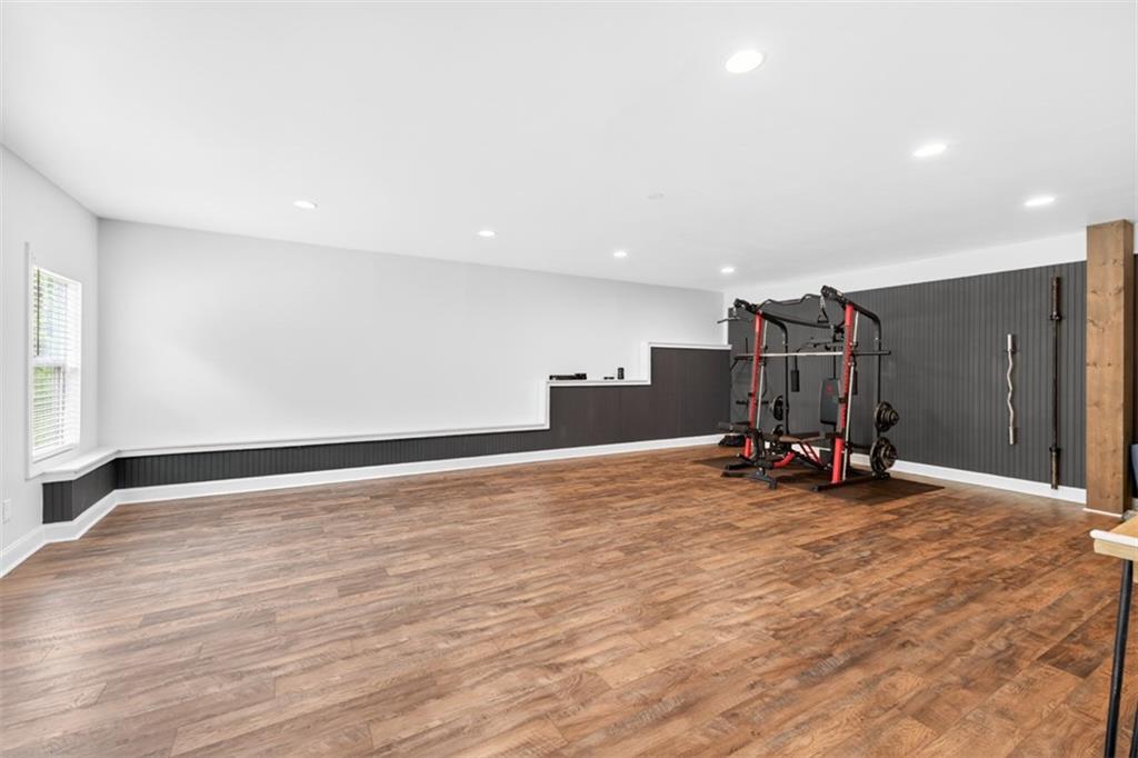 163 Hewett Road Pendergrass, GA 30567 - Photo 57 of 82 a view of a room with gym equipment and a large window
