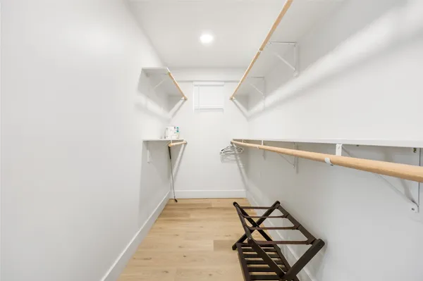 a spacious bathroom with a shower sink double vanity and a mirror