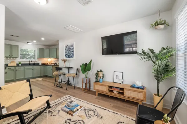 a kitchen with stainless steel appliances kitchen island granite countertop a stove and a sink