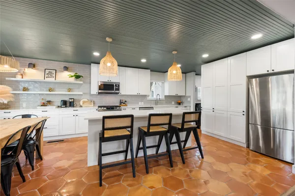 a kitchen with counter space cabinets and appliances
