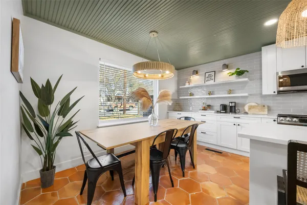 a large white kitchen with lots of counter top space
