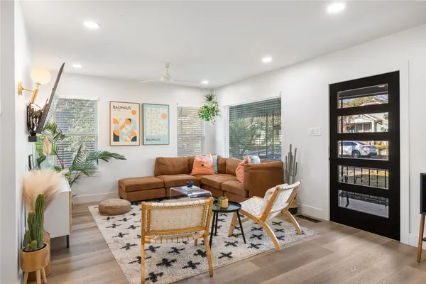 a kitchen with stove a sink and cabinets