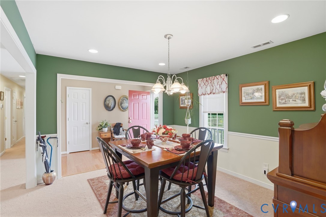 19012 Teman Road Beaverdam, VA 23015 - Photo 8 of 41 a dining room with furniture a chandelier and window